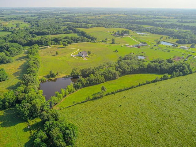 drone / aerial view featuring a water view and a rural view