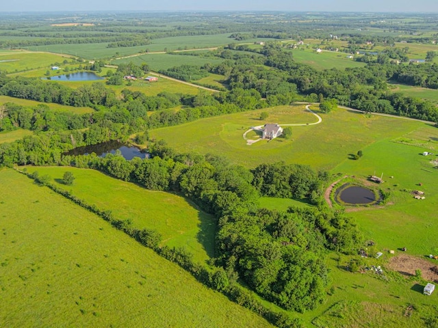 bird's eye view featuring a water view and a rural view