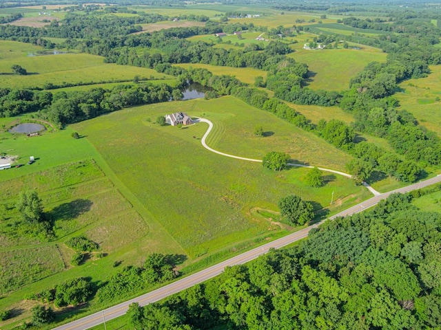 aerial view with a water view and a rural view