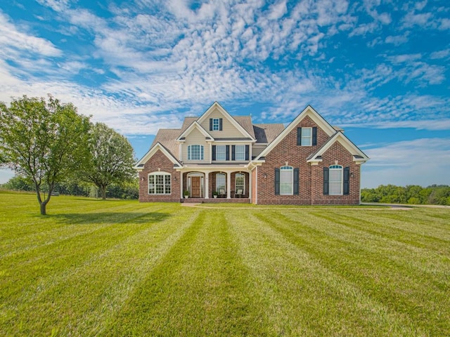 craftsman-style house with a front yard