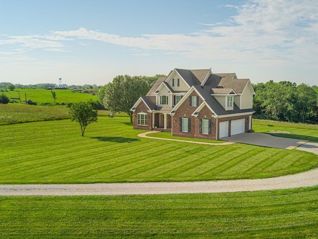 craftsman inspired home with a garage and a front lawn