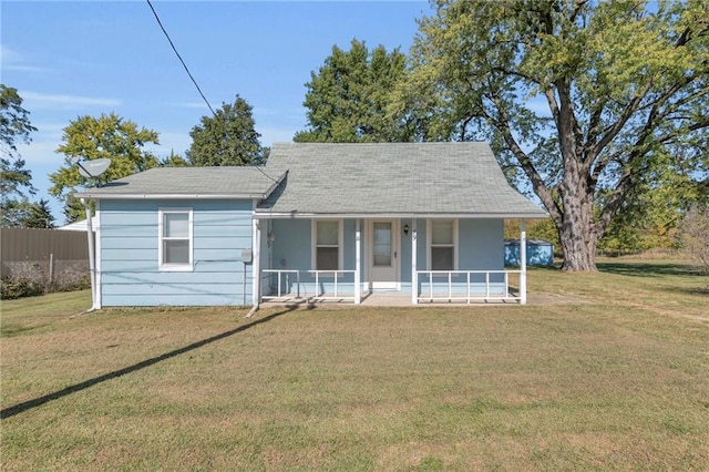 view of front of home featuring a front lawn and covered porch