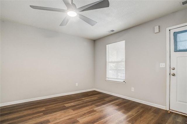 entrance foyer with ceiling fan and dark hardwood / wood-style flooring