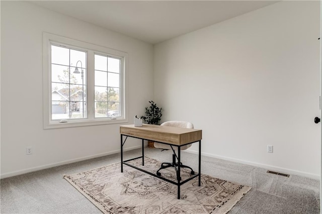 home office with light colored carpet