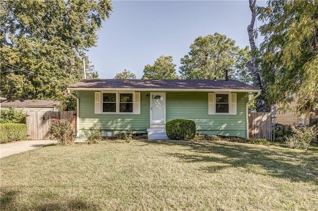 ranch-style home with a front lawn