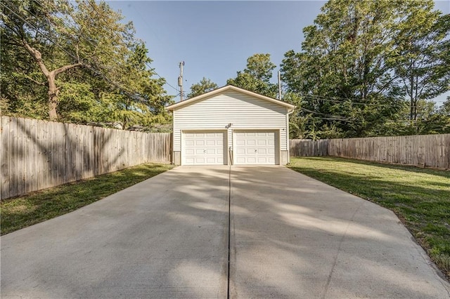 garage featuring a yard