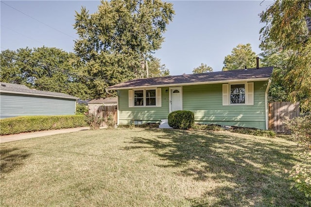 ranch-style home featuring a front lawn