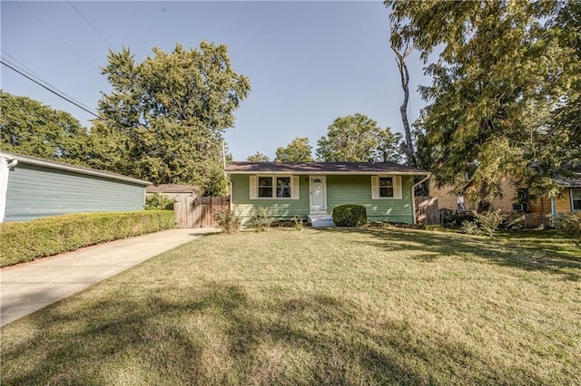 ranch-style home featuring a front yard