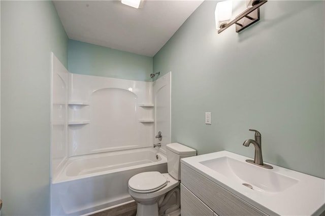 full bathroom featuring vanity, washtub / shower combination, and toilet