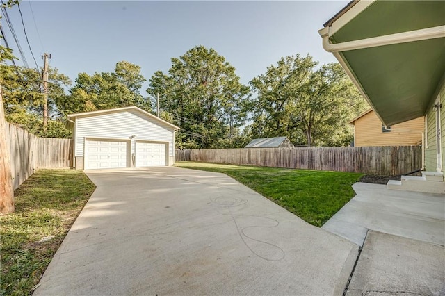 exterior space with a garage and an outbuilding