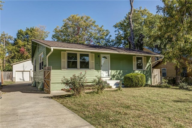 view of front of house featuring an outbuilding, a front lawn, a porch, and a garage