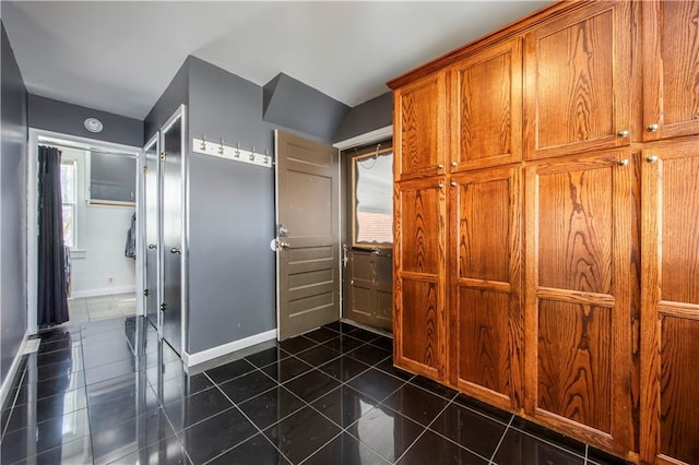 interior space with dark tile patterned floors