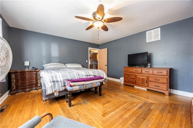 bedroom with ceiling fan and light hardwood / wood-style flooring