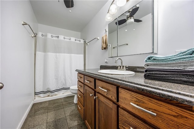 bathroom with ceiling fan, vanity, toilet, and a shower with shower curtain