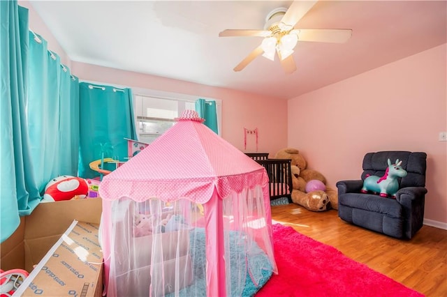 bedroom with hardwood / wood-style flooring and ceiling fan