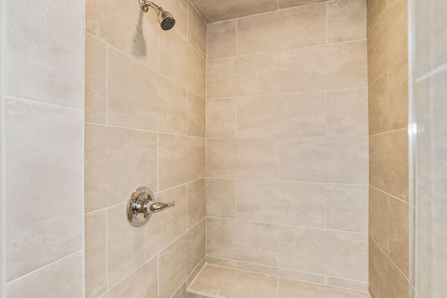 bathroom featuring tiled shower