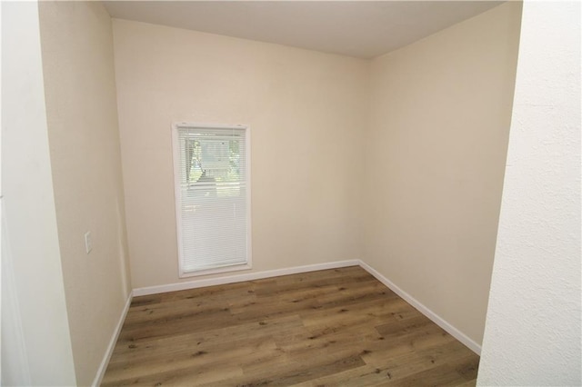 spare room with hardwood / wood-style flooring