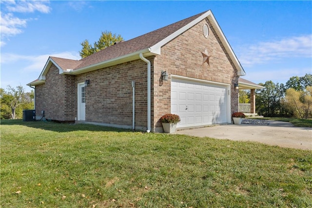 view of side of property with central air condition unit, a garage, and a yard