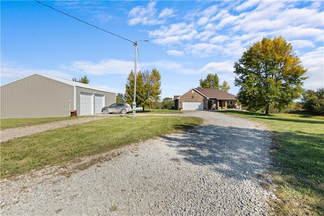 view of front of home with a garage and a front lawn