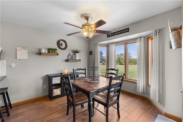 dining area featuring ceiling fan and hardwood / wood-style floors