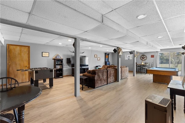 recreation room with light wood-type flooring, a drop ceiling, and pool table