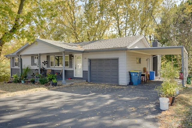 ranch-style home featuring a carport, a porch, and a garage