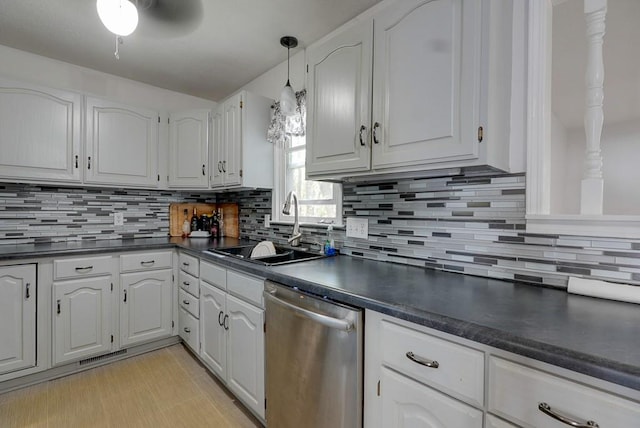 kitchen featuring tasteful backsplash, ceiling fan, white cabinetry, dishwasher, and sink