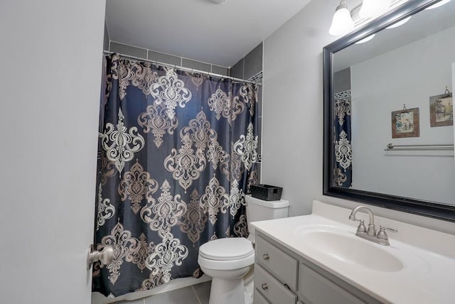 bathroom with vanity, toilet, curtained shower, and tile patterned flooring