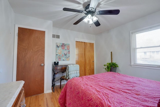 bedroom with light wood-type flooring and ceiling fan