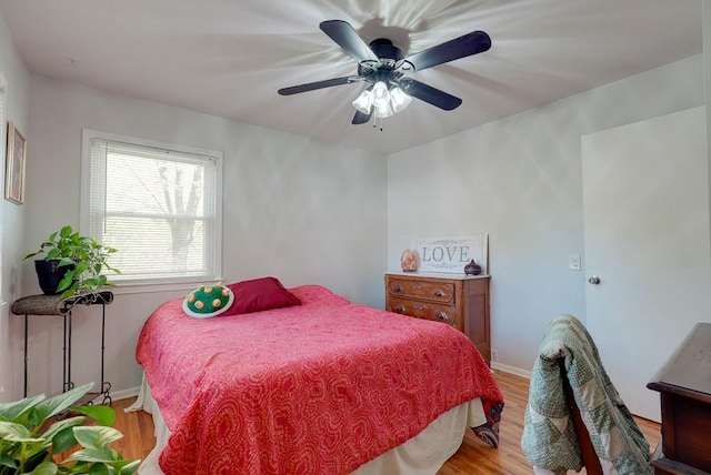 bedroom featuring ceiling fan and light hardwood / wood-style floors