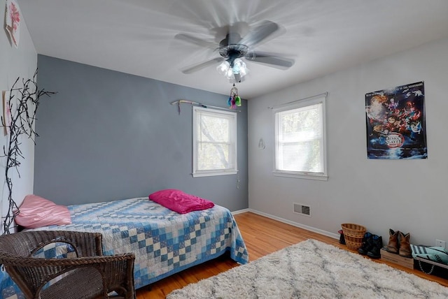 bedroom featuring hardwood / wood-style flooring and ceiling fan