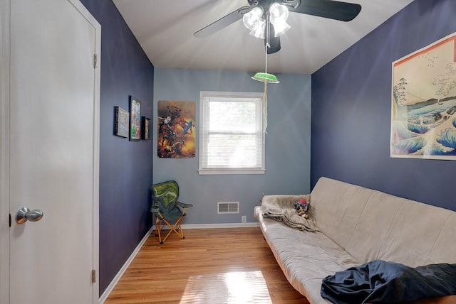 sitting room with light hardwood / wood-style flooring and ceiling fan