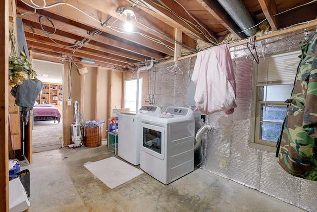 clothes washing area with washer and dryer