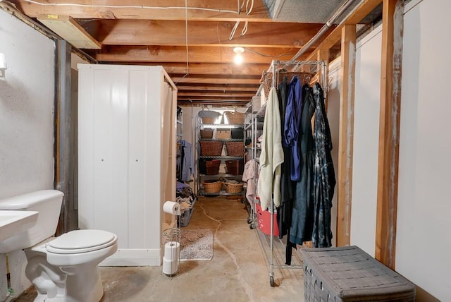 bathroom featuring toilet and concrete floors