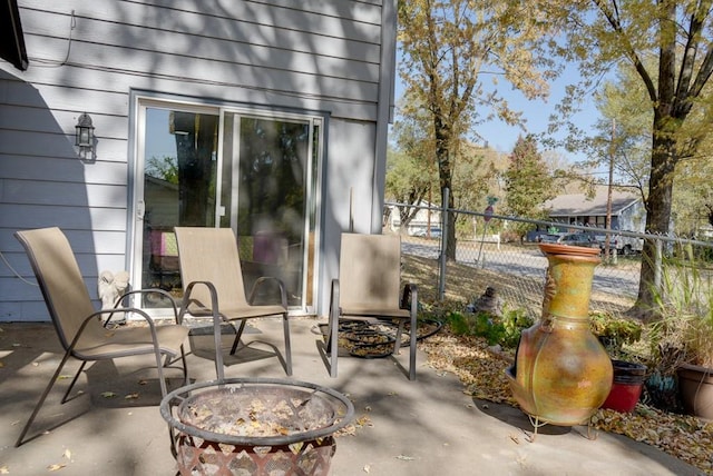 view of patio / terrace with an outdoor fire pit