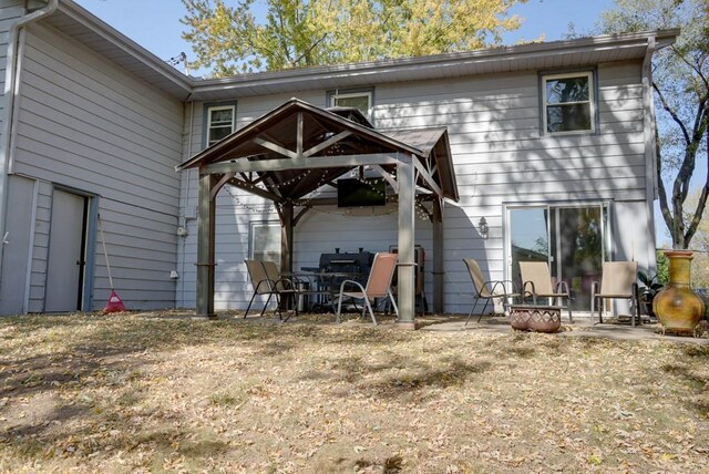 1101 Williams St, Excelsior Springs, MO 64024 - rear view of house featuring a gazebo and a patio area