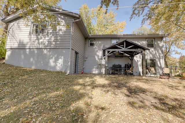 back of property featuring a lawn