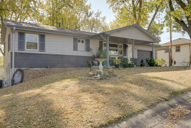 single story home featuring a front yard, a garage, and covered porch