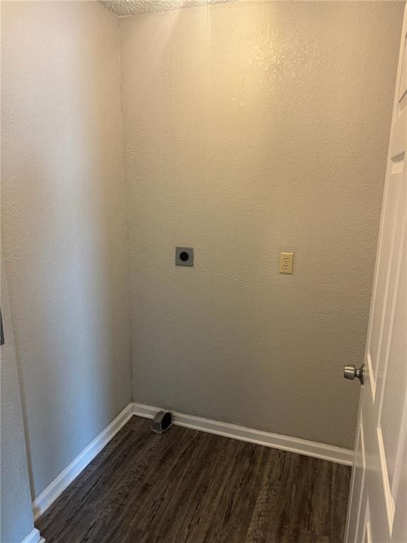 washroom featuring hookup for an electric dryer and dark wood-type flooring