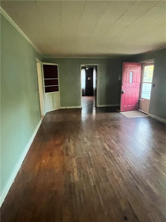 interior space featuring dark hardwood / wood-style floors and ornamental molding