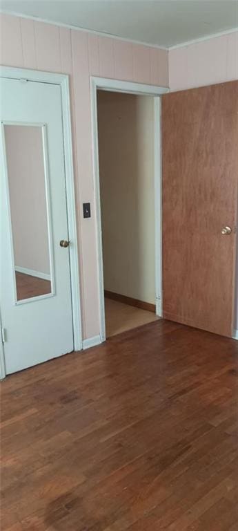 empty room featuring dark wood-type flooring