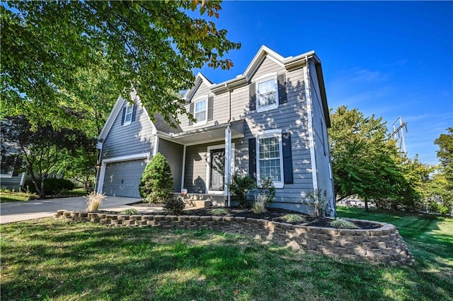 view of front of property with a garage and a front lawn