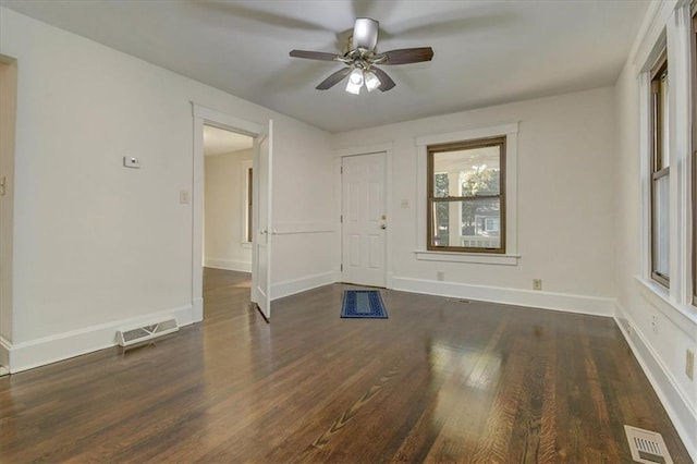 unfurnished room featuring ceiling fan and dark hardwood / wood-style flooring