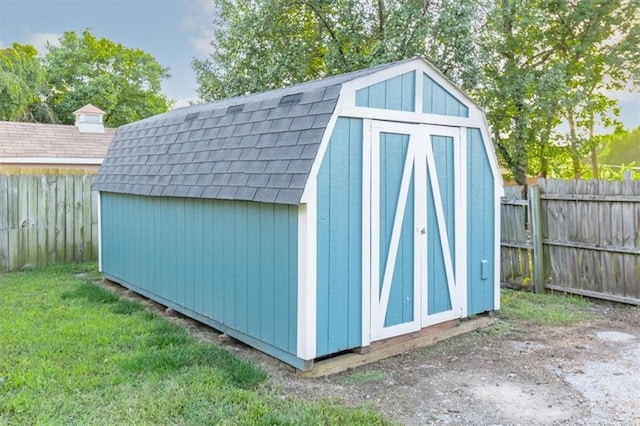 view of outbuilding featuring a yard