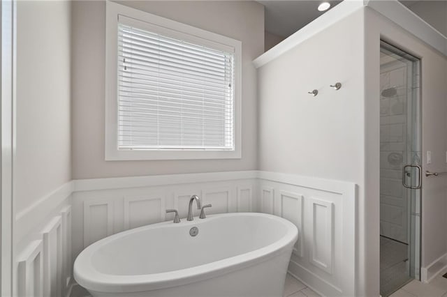 bathroom featuring independent shower and bath and tile patterned floors