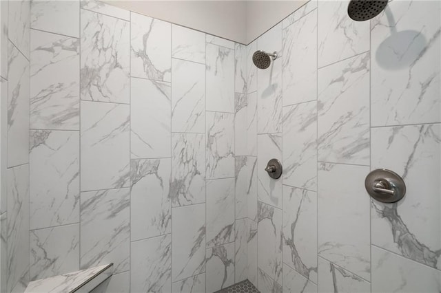 bathroom with tiled shower