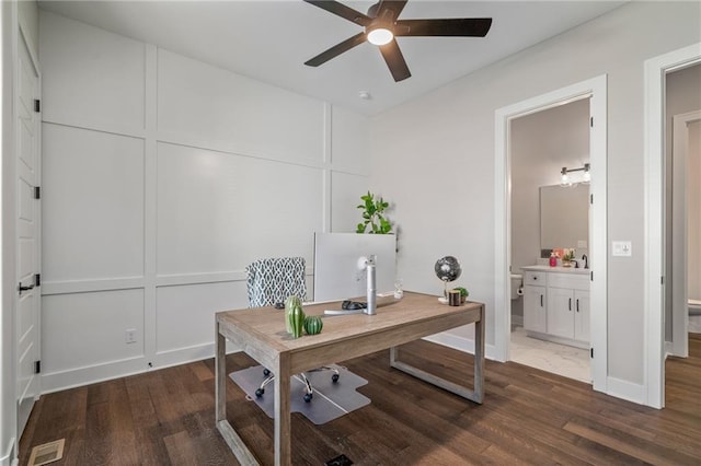 office space with ceiling fan and dark wood-type flooring