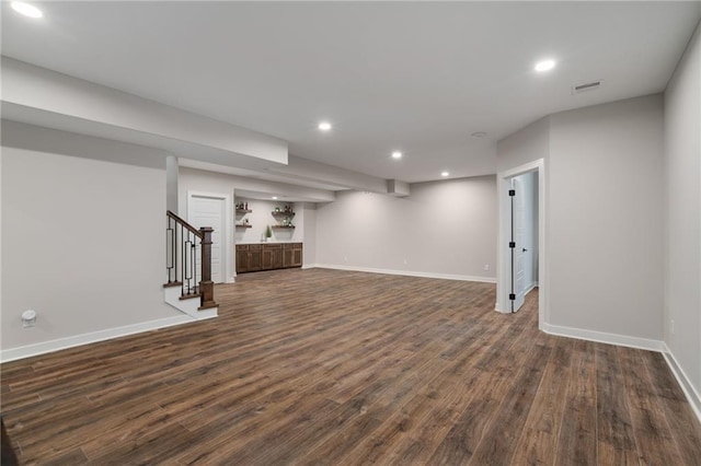 basement featuring dark hardwood / wood-style flooring