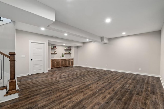 unfurnished living room with dark hardwood / wood-style floors