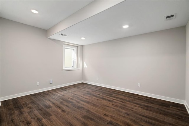 empty room featuring dark wood-type flooring